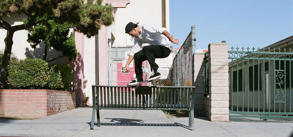 Skateboard grind on bench